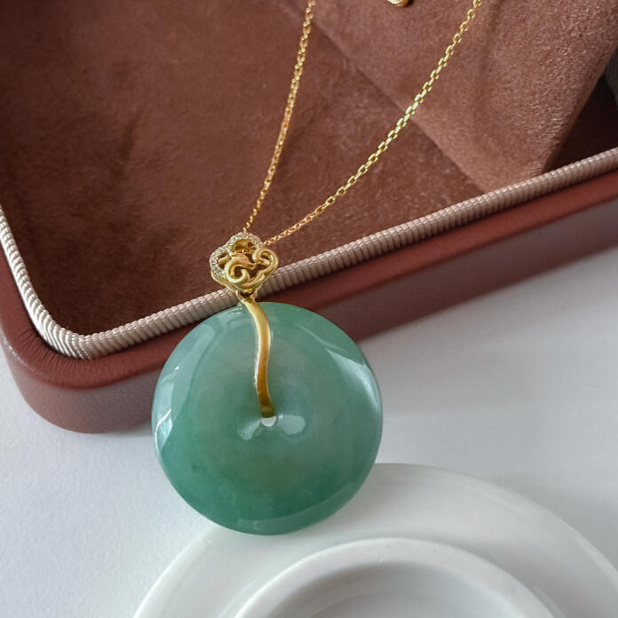 Green jadeite doughnut with customised cloud gold bail with diamonds