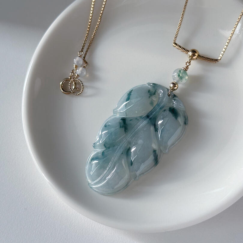 Flora jadeite leaf with translucent flora top bead and gold bead bail on gold chain necklace